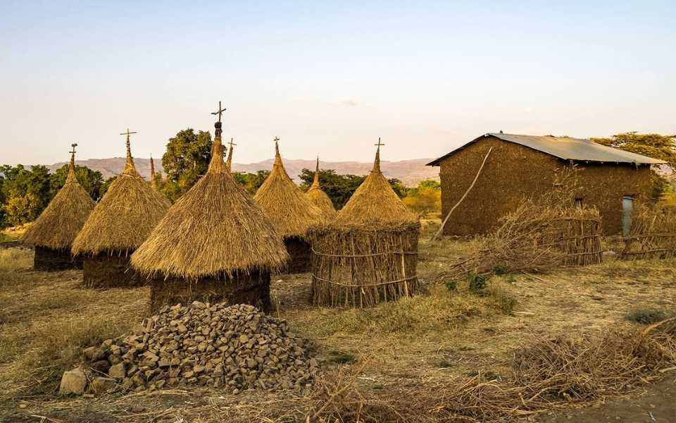 Some thatched houses with piles of stones in Ethiopia, Africa. Concept of the Amharic language of Ethiopia.