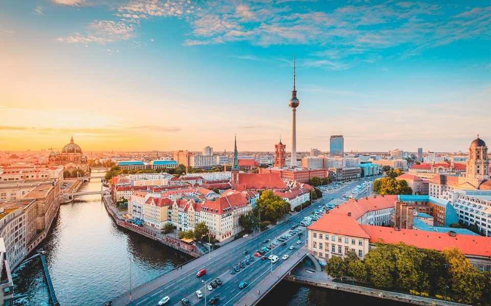 A view of Berlin in the light of a beautiful golden evening. Concept of English to German translation. 