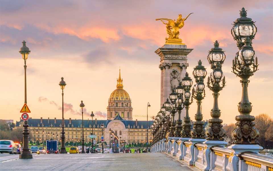 Spectacular sunrise view of the Alexander III Bridge across the Seine. Concept of French translation service.