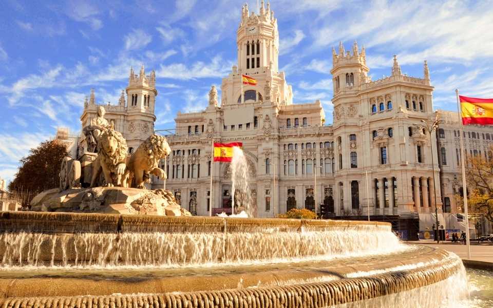 The neoclassical Fountain of Cybele during daytime in Madrid, Spain. Concept of the Spanish language and speakers with some facts.