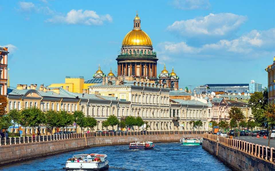 Saint Isaac Cathedral across Moyka river at noon. Concept of Russian translation services.
