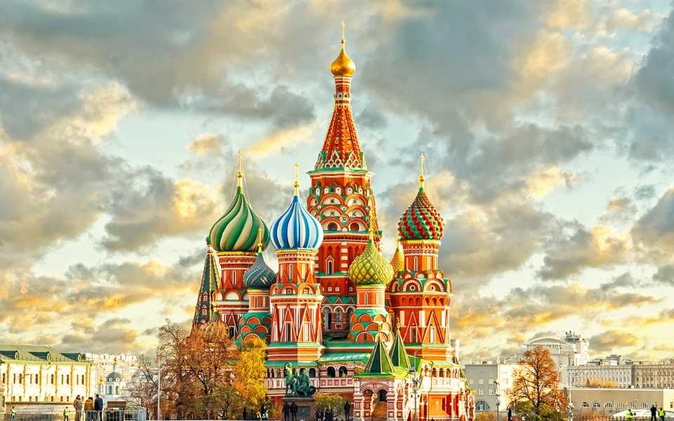 St. Basil's Cathedral in Moscow and its beautiful colours and domes. Concept of English to Russian translation. 
