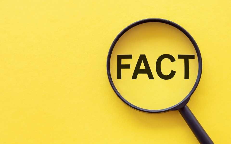 The word "Fact" written in black with a magnifying glass on it.
