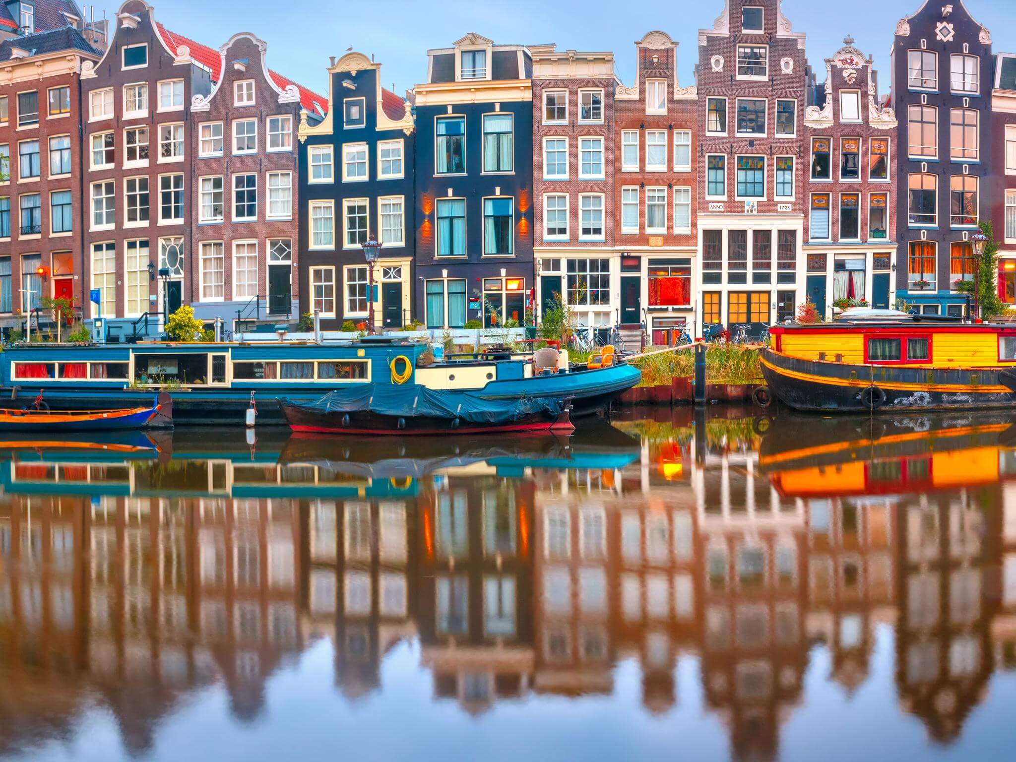 Panoramic autumn view of Dutch channels in Amsterdam, Netherlands. Concept of Dutch language, learning and speaking Dutch words while in the Netherlands.