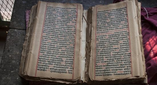Ancient manuscript of an Indian book at Varanasi Uttar Pradesh. Concept of academic Sanskrit translation.