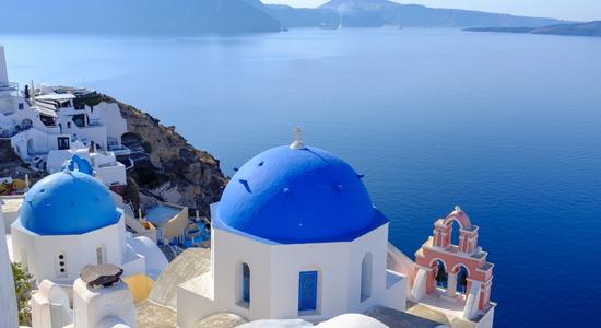 The Santorini Caldera, with white buildings to the left and right.