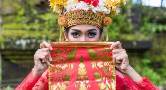 A Balinese lady wearing traditional clothes. Concept of professional Bahasa translators.  