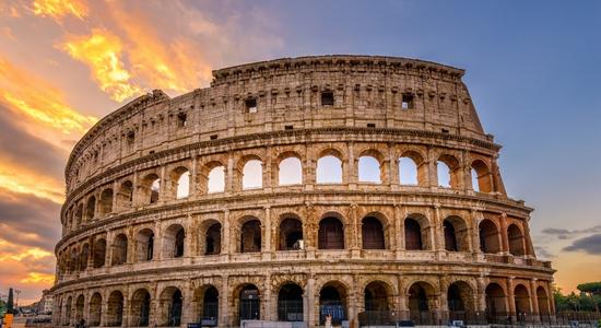 A sunset view of the Colosseum in Rome, Italy. Concept of Italian translation services.