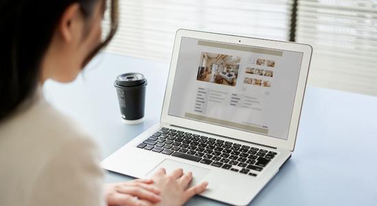 Chinese woman browsing a website using laptop. Concept of Chinese translation services.