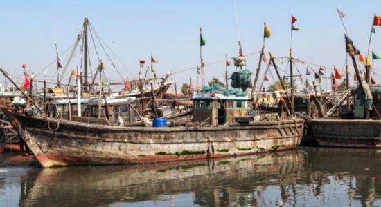 Fishing boats at fisheries terminal at Arabian sea.