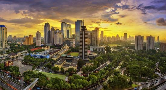 Aerial view of skyscrapers and modern buildings in the business district in Jakarta, Indonesia.