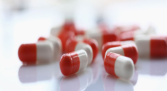 Drug tablets on table of laboratory. 