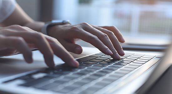 Young woman hands typing on laptop keyboard. 
