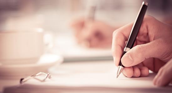 Man hand signing a contract. Concept of legal Dutch translation.