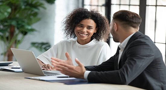 Female and male employees working together. 