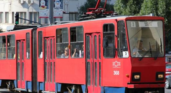 Belgrade red tram transporting people. Concept of technical Serbian translation.