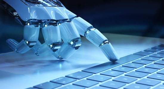 A white robot hand pressing index finger on keyboard space bar.