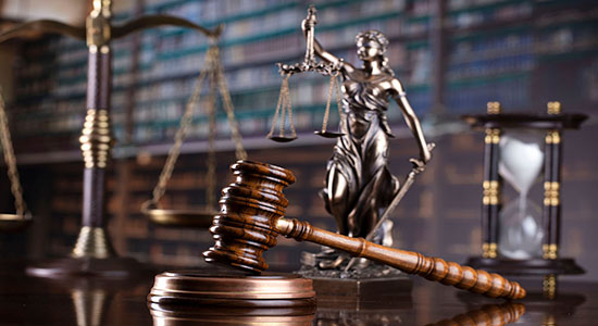 A judge's gavel in library. Concept of legal document translation services UK. 
