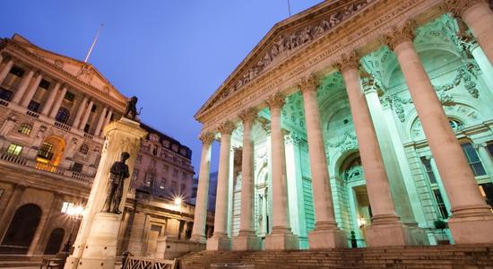 A low-angle shot of the Bank of England, London in the evening. 