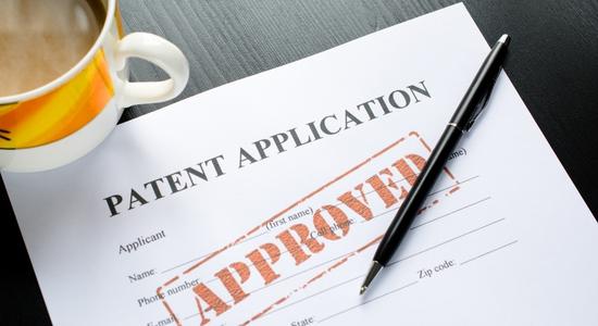 Approved patent application on table. 