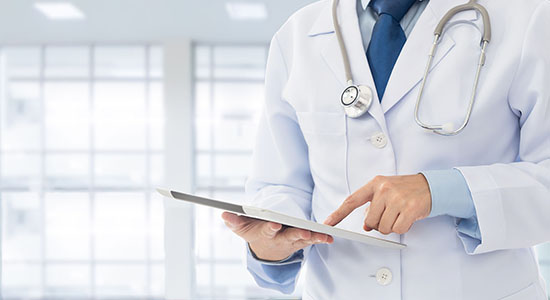 Doctor using tablet. 