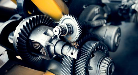 The gray interlocking parts and gears of a machine or motor. 