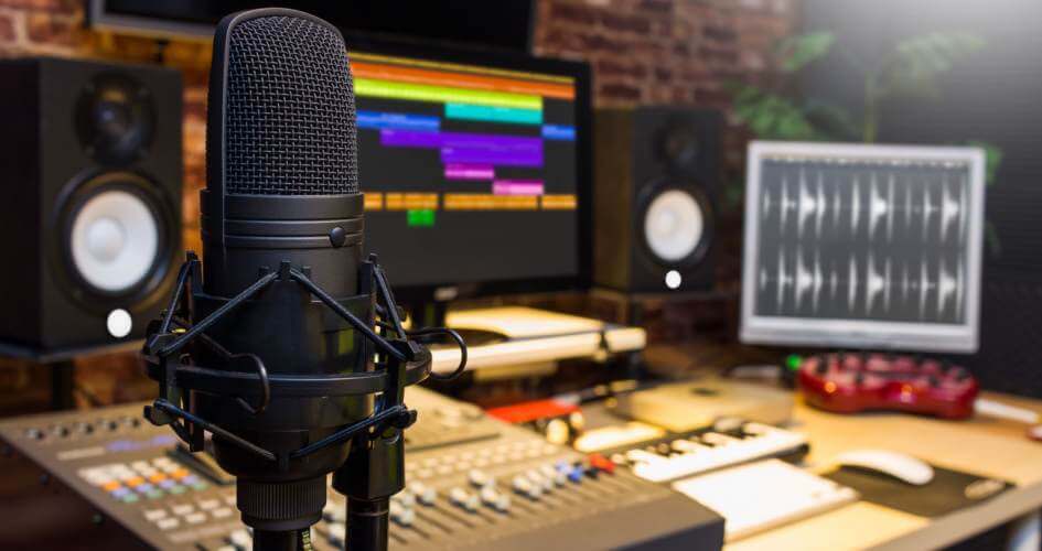 A condenser microphone in a studio for digital sound editing and recording. A concept of professional voiceover services.